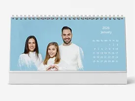 Desk calendar template featuring a friendly family with a daughter on a blue background