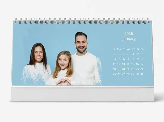 Desk calendar template featuring a friendly family with a daughter on a blue background
