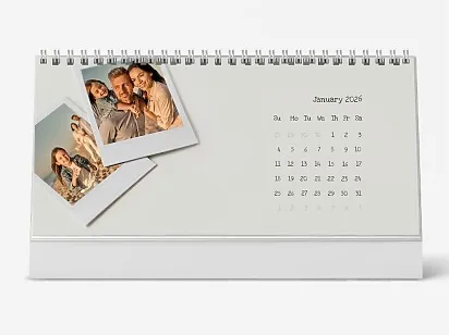 A desk calendar template with Polaroid photos in a minimalist retro style.