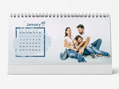 Desk calendar template featuring a happy family of four on a white background.